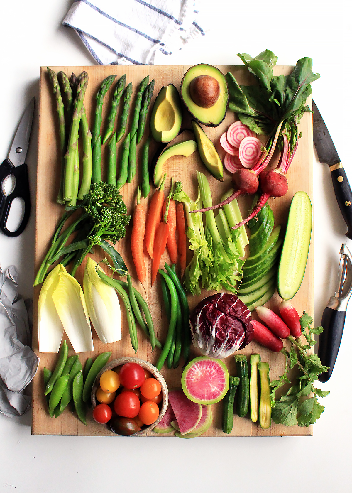 vegetables cut for crudites on cutting board